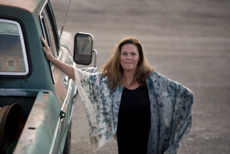 Laura holding on to her truck and thinking about the Haven Writing Retreats